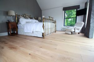 Wooden flooring in open bedroom