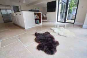 Tiled Kitchen Flooring with fluffy rugs