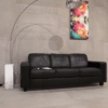 Concrete Mid Grey Effect Porceline Tile on walls and floor in minimalistic room with black sofa