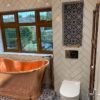 Maroc Blue Patterned Wall Tile and Feature Alcove with Copper Bath
