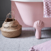 Parisian Chic Porcelain Angelina displayed on bathroom floor with chic pink bathtub